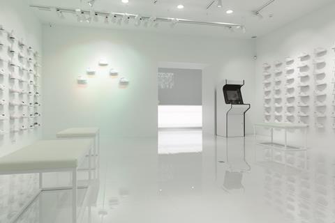 The store is the ultimate exercise in white space minimalism with walls, cash desk and even a vintage arcade game all in varying shades of cool white
